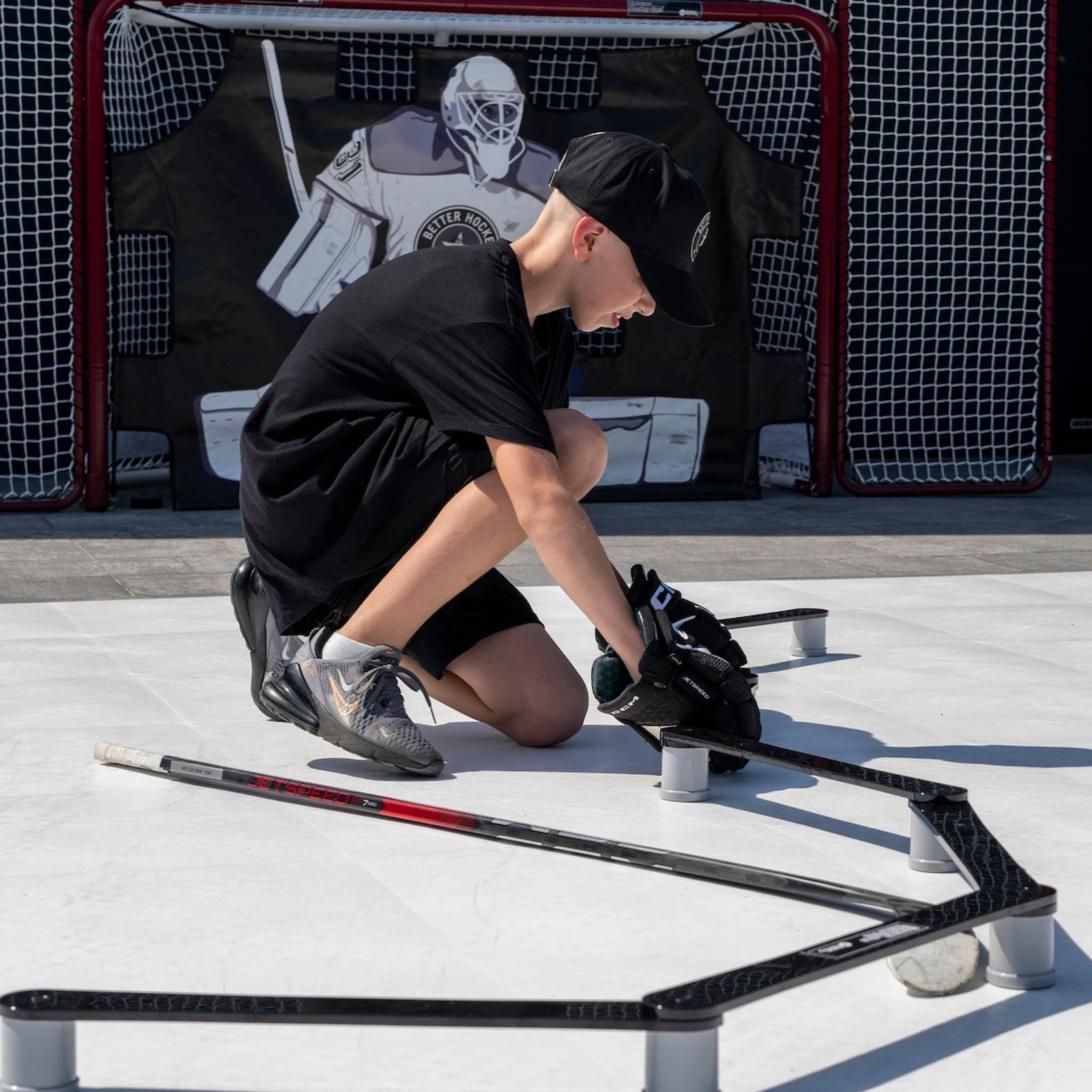 Better Hockey folded and being carried showing lightweight portability for travel