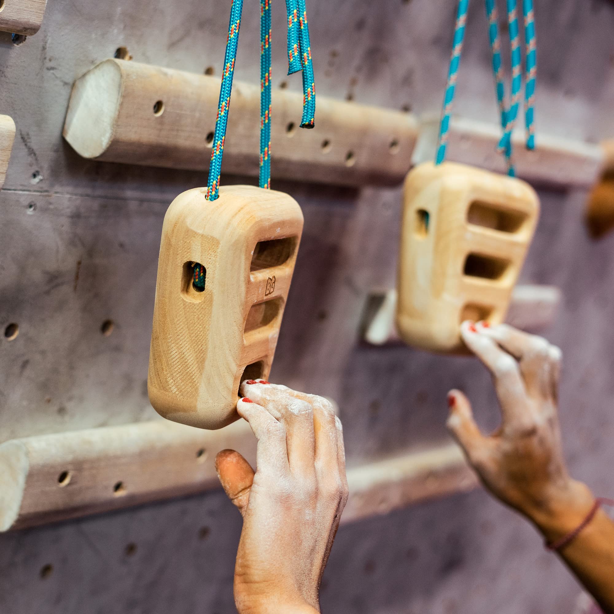 BG Climbing athlete using hangboard to build pull and finger strength