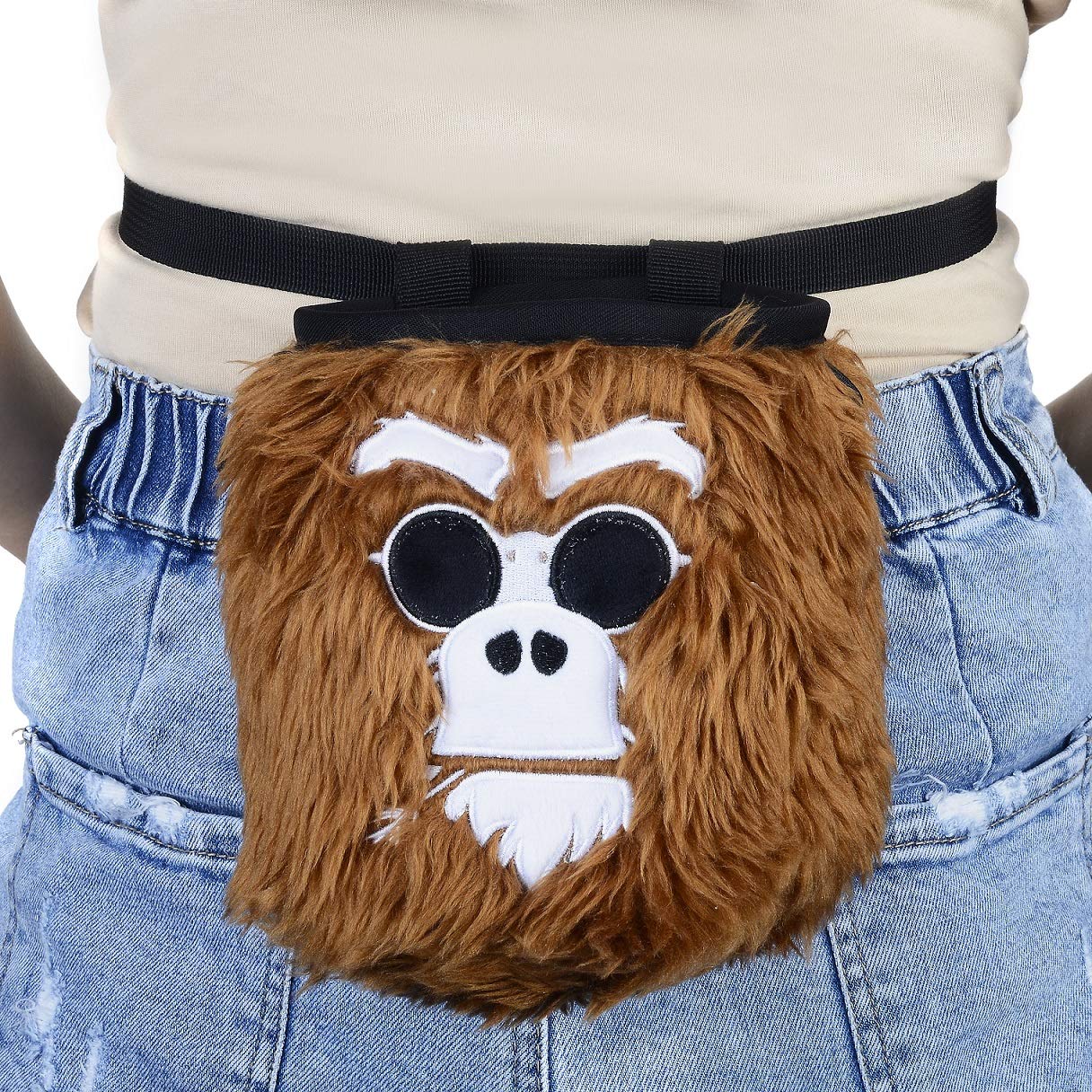 BG Climbing monkey chalk bag next to harness showing compact size advantage