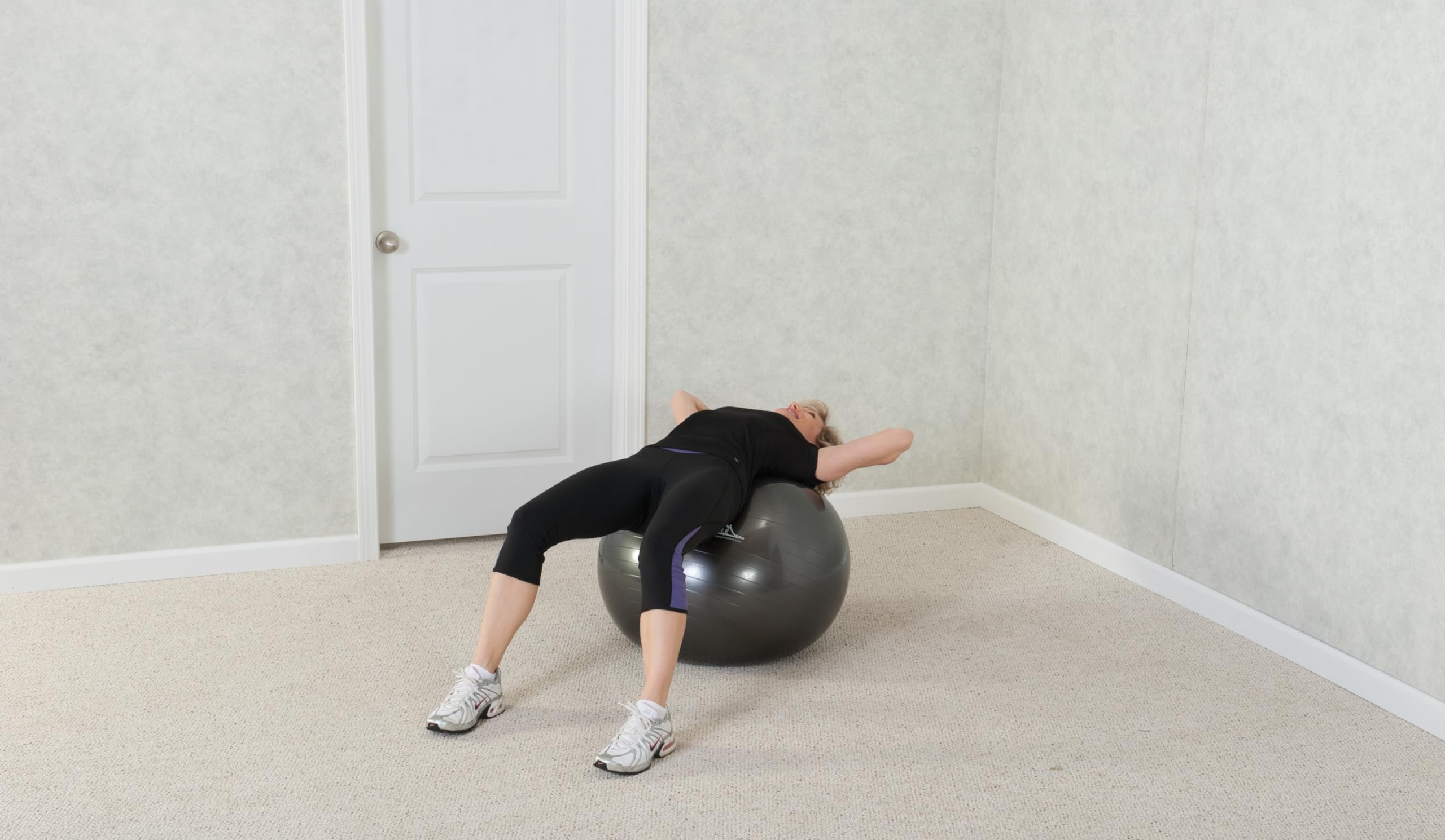 Black Mountain Products used in a gym balance exercise showing core-strength benefit