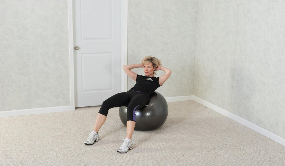 Black Mountain Products ball used as office seat demonstrating improved posture benefit