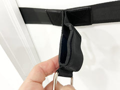 bodylastics Ultra Anchor installed on door in use demonstrating stable band workouts