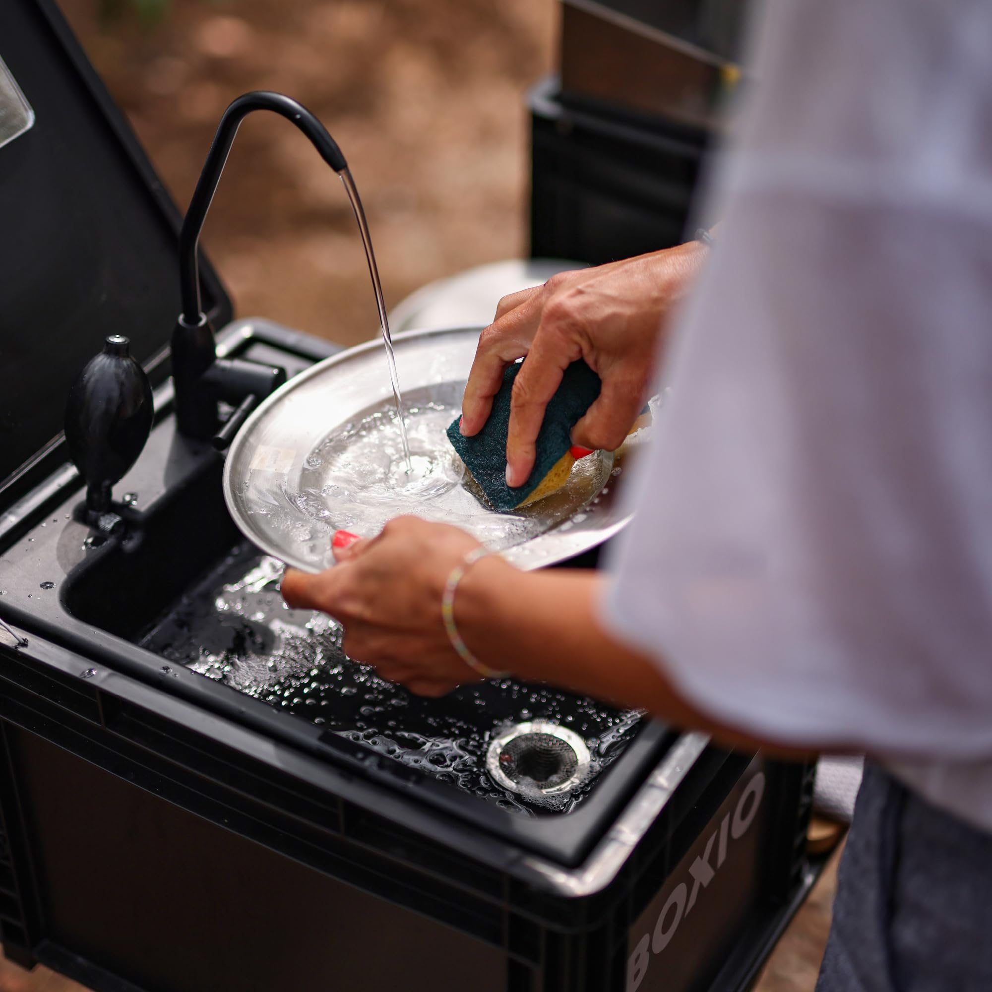 BOXIO packed in car trunk showing compact transportability