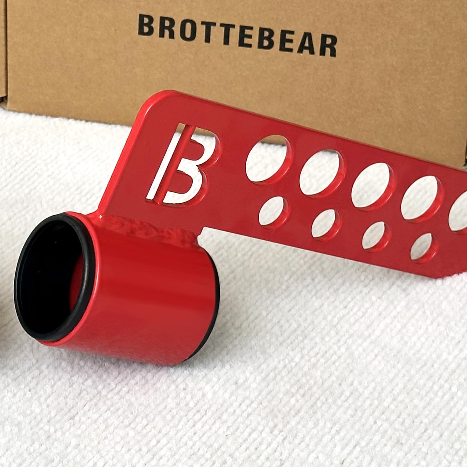 BROTTEBEAR attachment beside standard barbell showing compact size and space saving