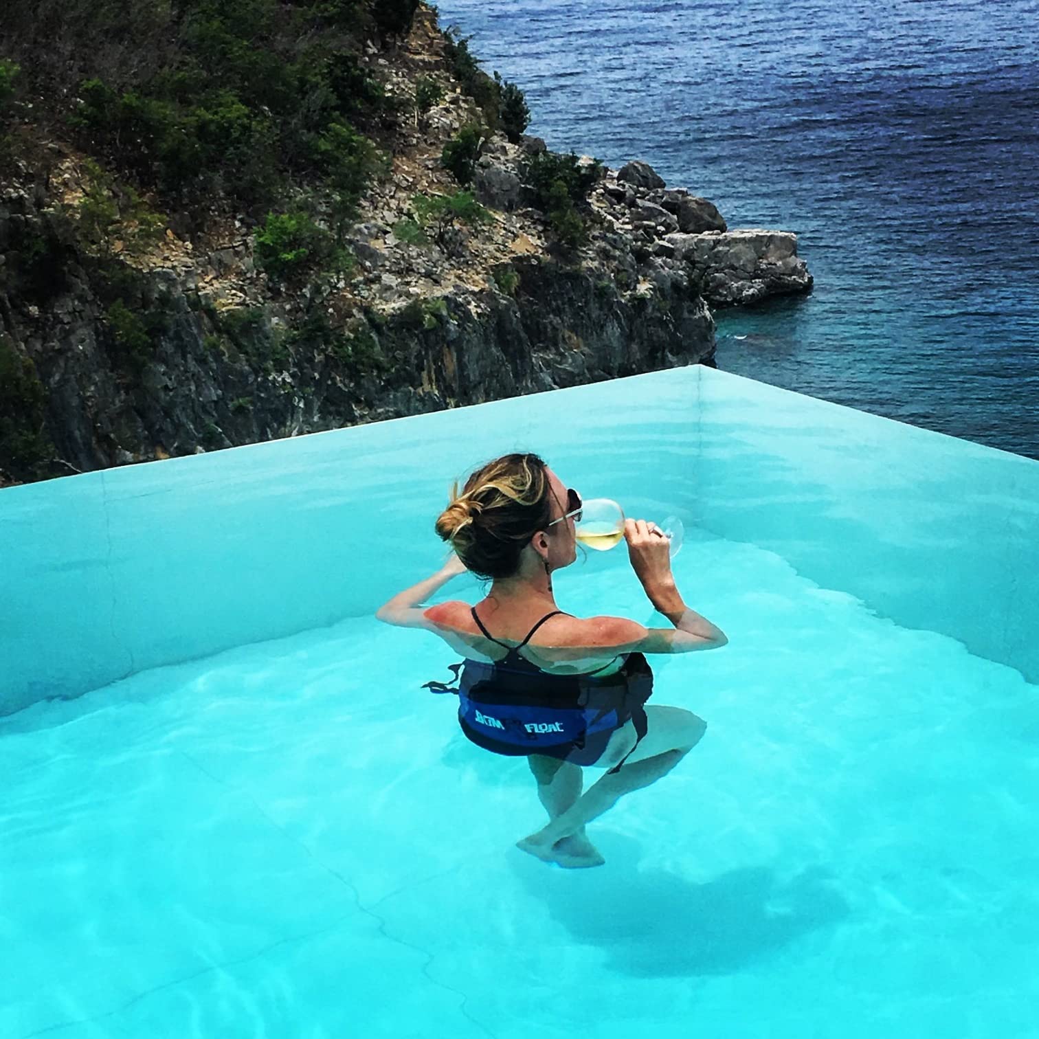 BUM FLOAT in-pool lifestyle scene showing relaxed floating and social use