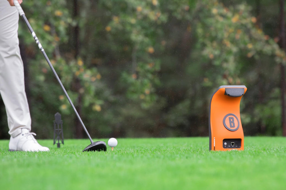 Bushnell Launch Pro held in hand showing compact size for portability