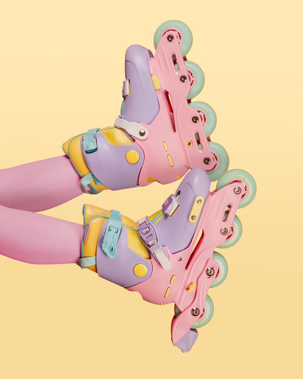 C SEVEN skate next to ruler to show adjustable size and growth-friendly fit