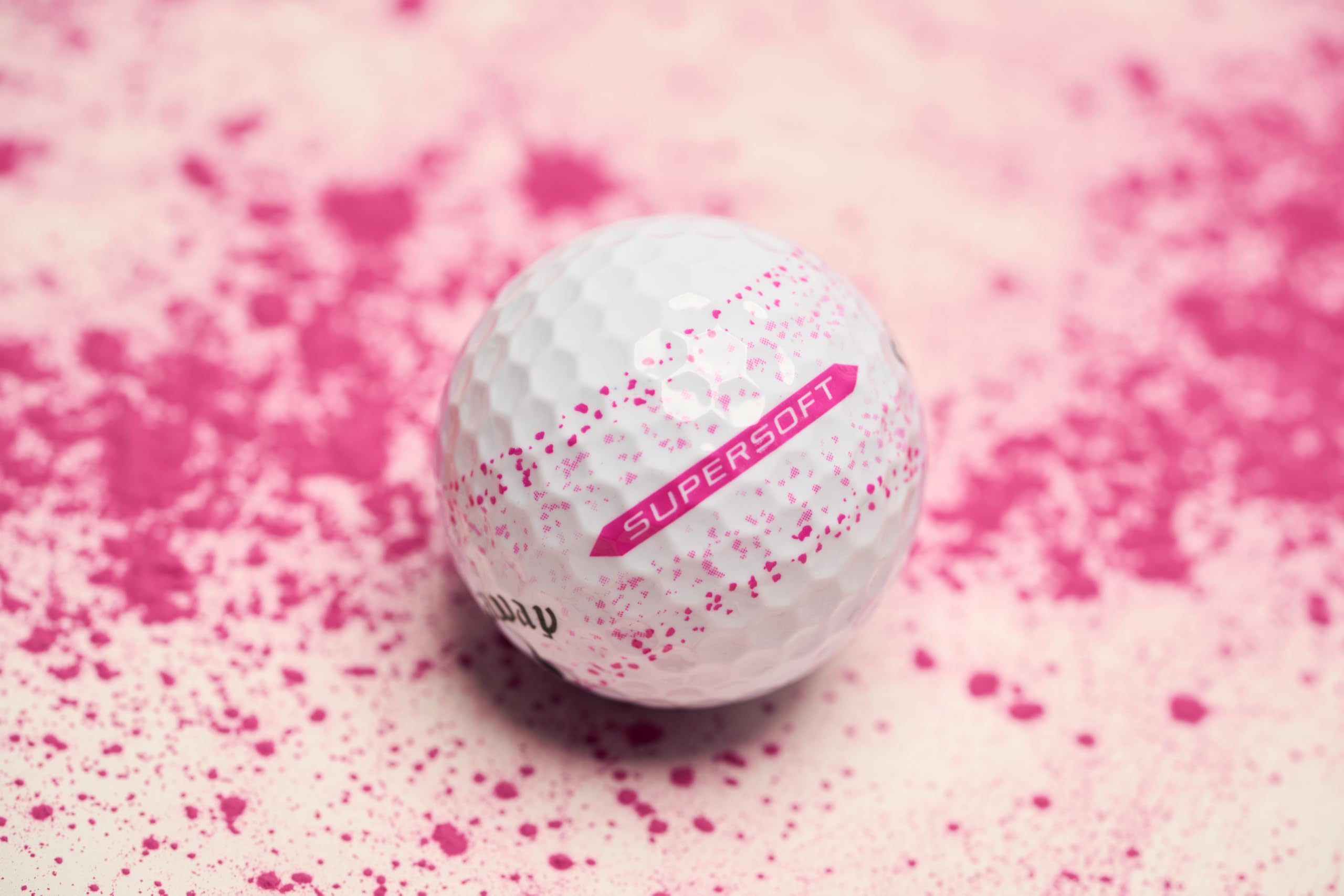 Callaway balls beside golf bag on course showing visibility and stylish design for on-course confidence