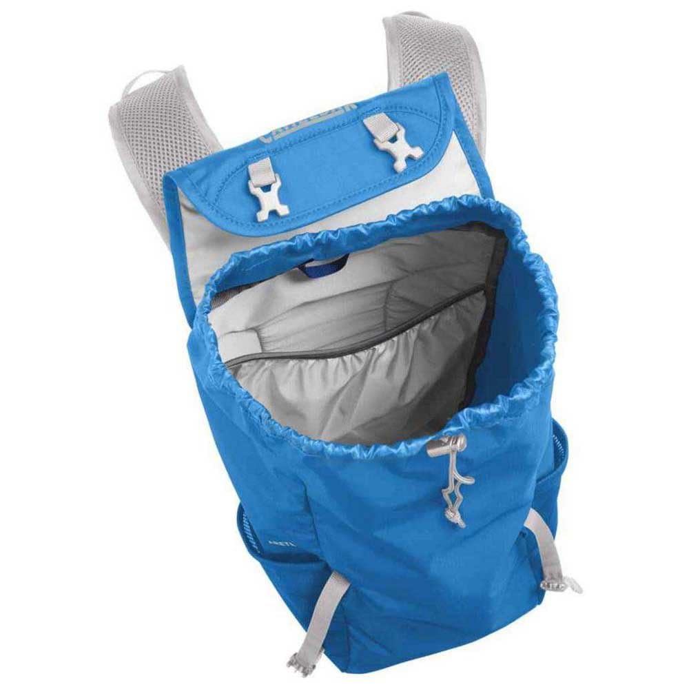 CamelBak Arete 18 packed next to everyday items showing compact stowability benefit