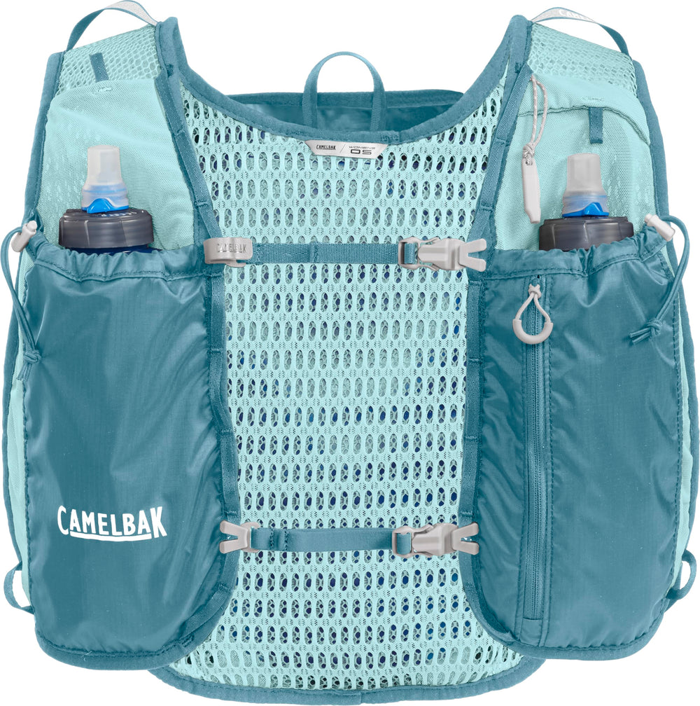 CamelBak vest beside a water bottle showing compact capacity and low weight benefit