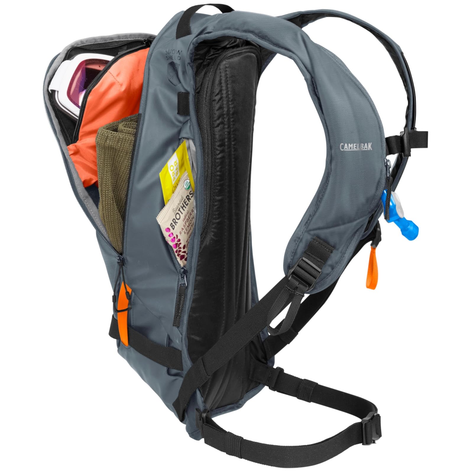 CamelBak powderhound 12 size scale with helmet illustrating compact capacity on the hill