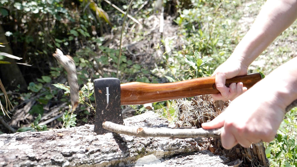Camillus hatchet in use at camp showing efficient wood chopping benefit