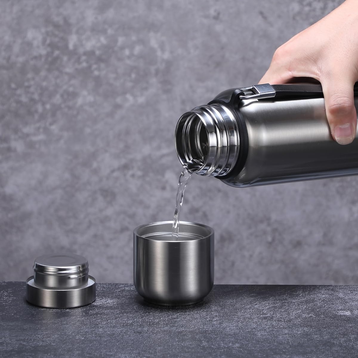 CDJ held in hand showing 34oz size and portability benefit