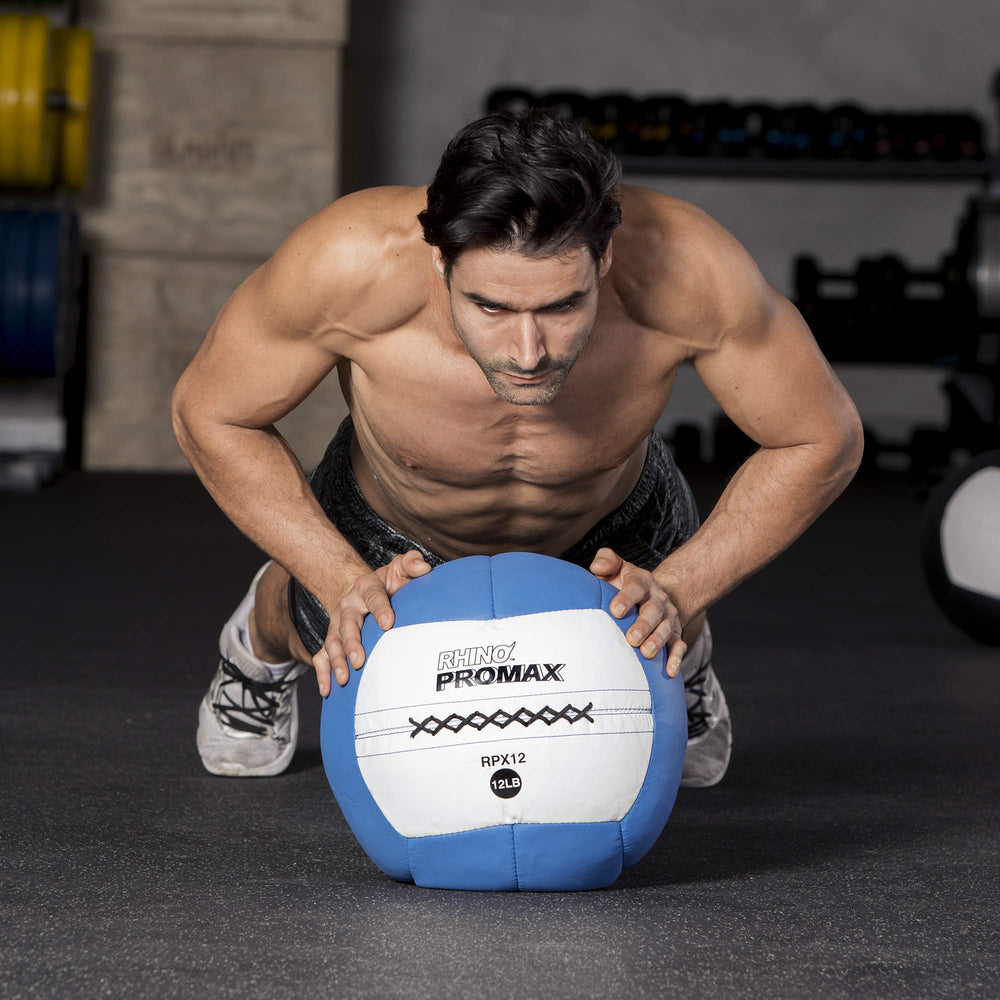 Hand holding Champion Sports RHINO Promax to show scale and ergonomic 14-inch size for better technique