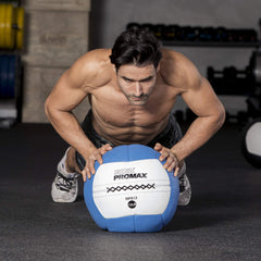 Hand holding Champion Sports RHINO Promax to show scale and ergonomic 14-inch size for better technique