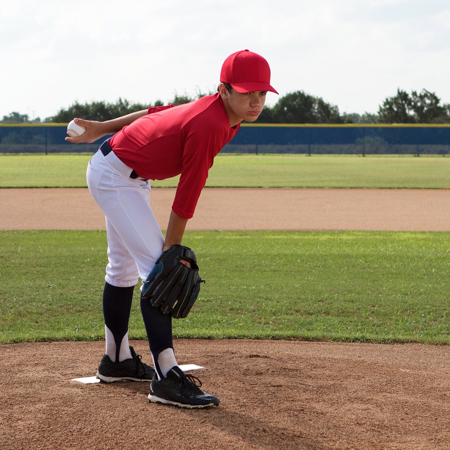 Champion Sports pitcher using plate on field showing consistent pitching reference benefit