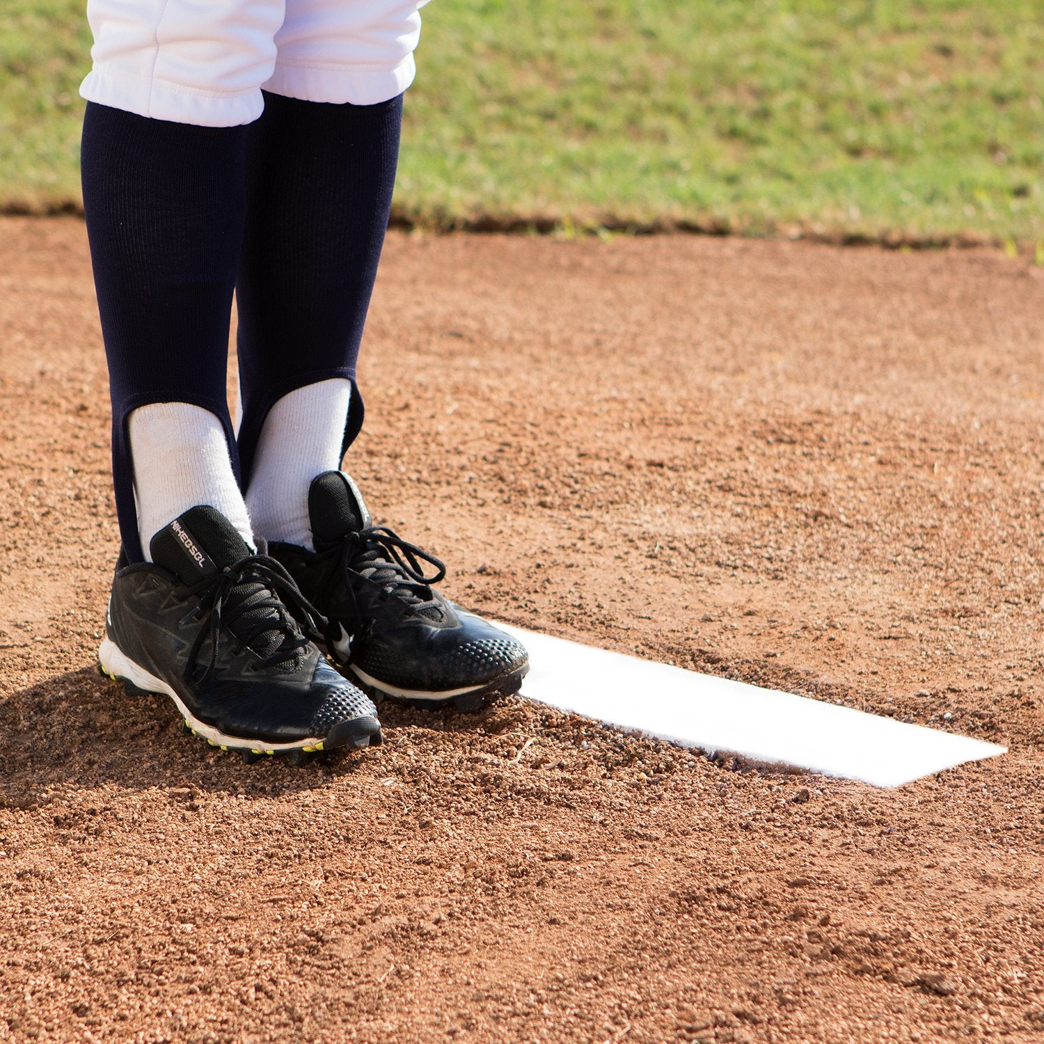 Champion Sports plate installed in-ground showing stable setup benefit