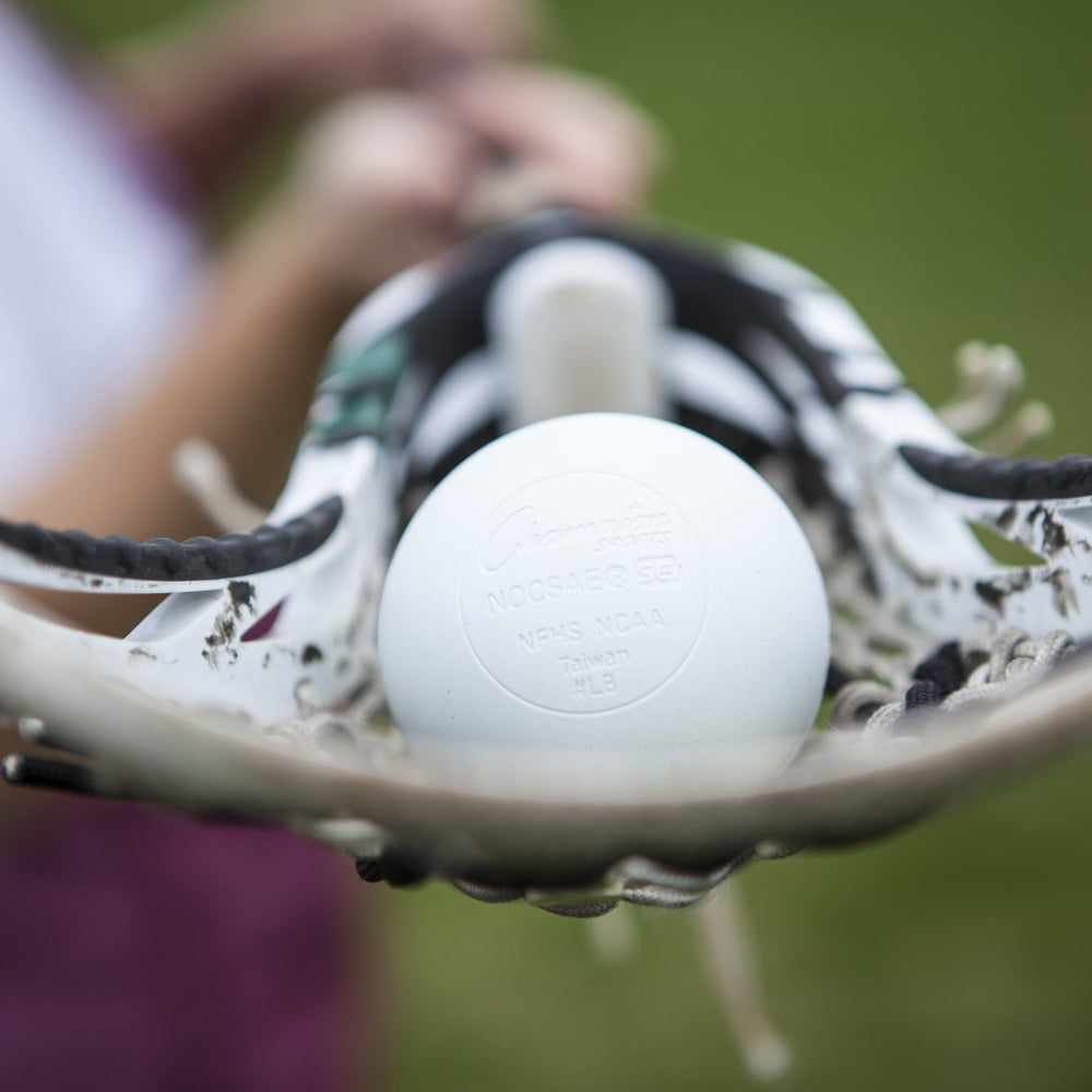 Champion Sports lacrosse ball with scuff marks showing long-lasting resilience benefit
