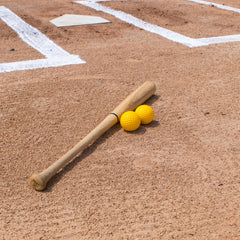 Champion Sports ball in mid-swing during batting practice to improve reps