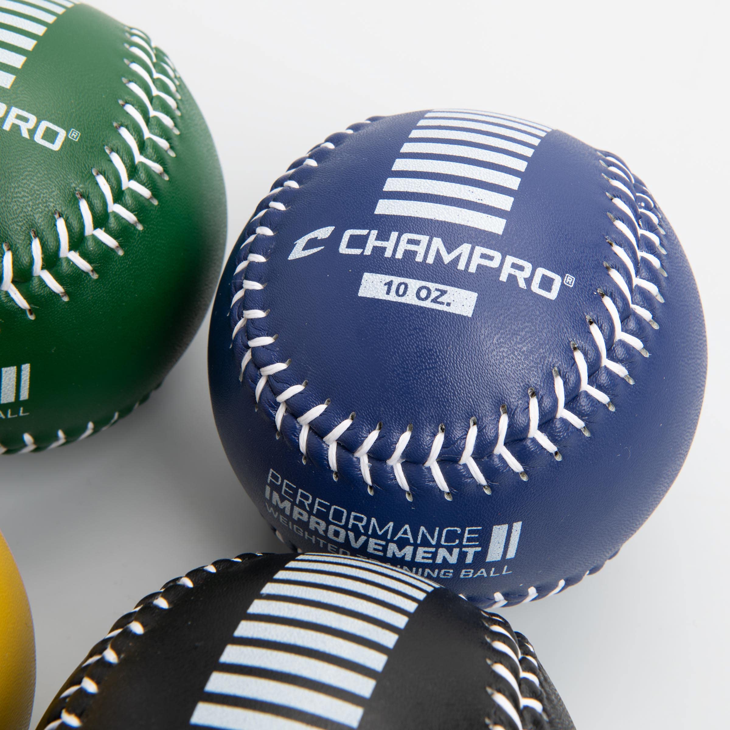 CHAMPRO softball held in hand showing 12-inch scale and control benefits