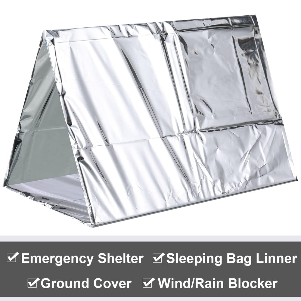 Chumia in use camping wrapped around hiker for emergency warmth and wind protection