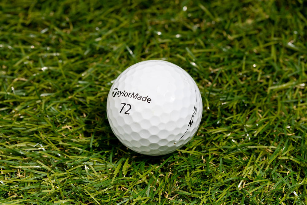 Clean Green Golf Balls in hand demonstrating playable condition
