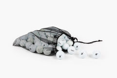 Clean Green Golf Balls packed in reusable mesh bag for easy transport and storage