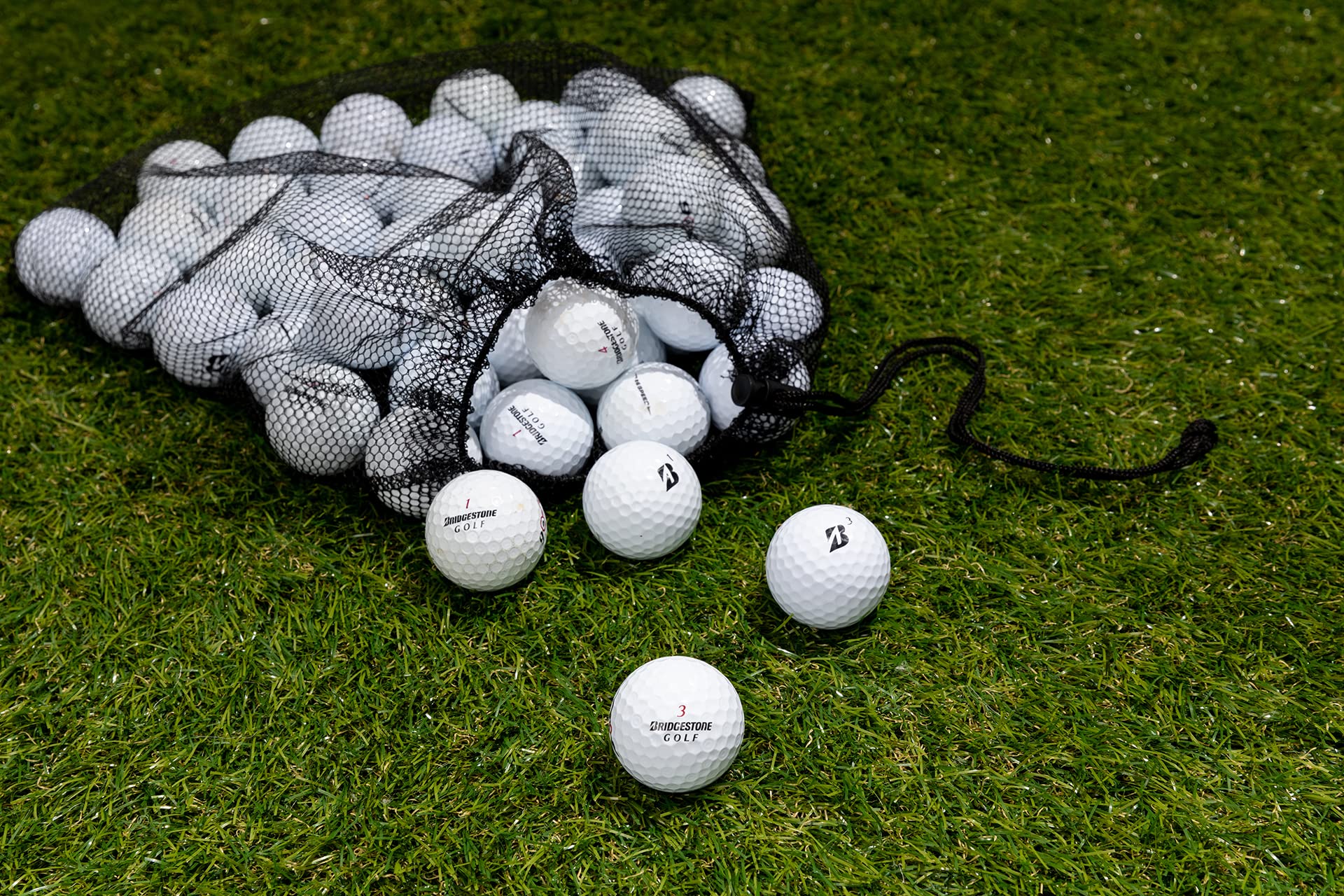 Clean Green Golf Balls on a driving range mat showing practical use and savings