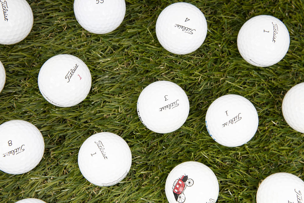 Clean Green Golf Balls single Titleist Pro V1 held in hand to show size and scale for play