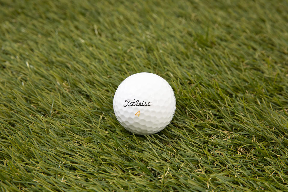 Clean Green Titleist Velocity on tee demonstrating ready-to-use performance on course