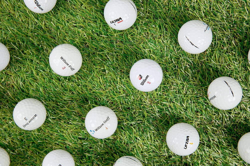 Clean Green Golf Balls pile on grass showing eco-friendly reuse advantage