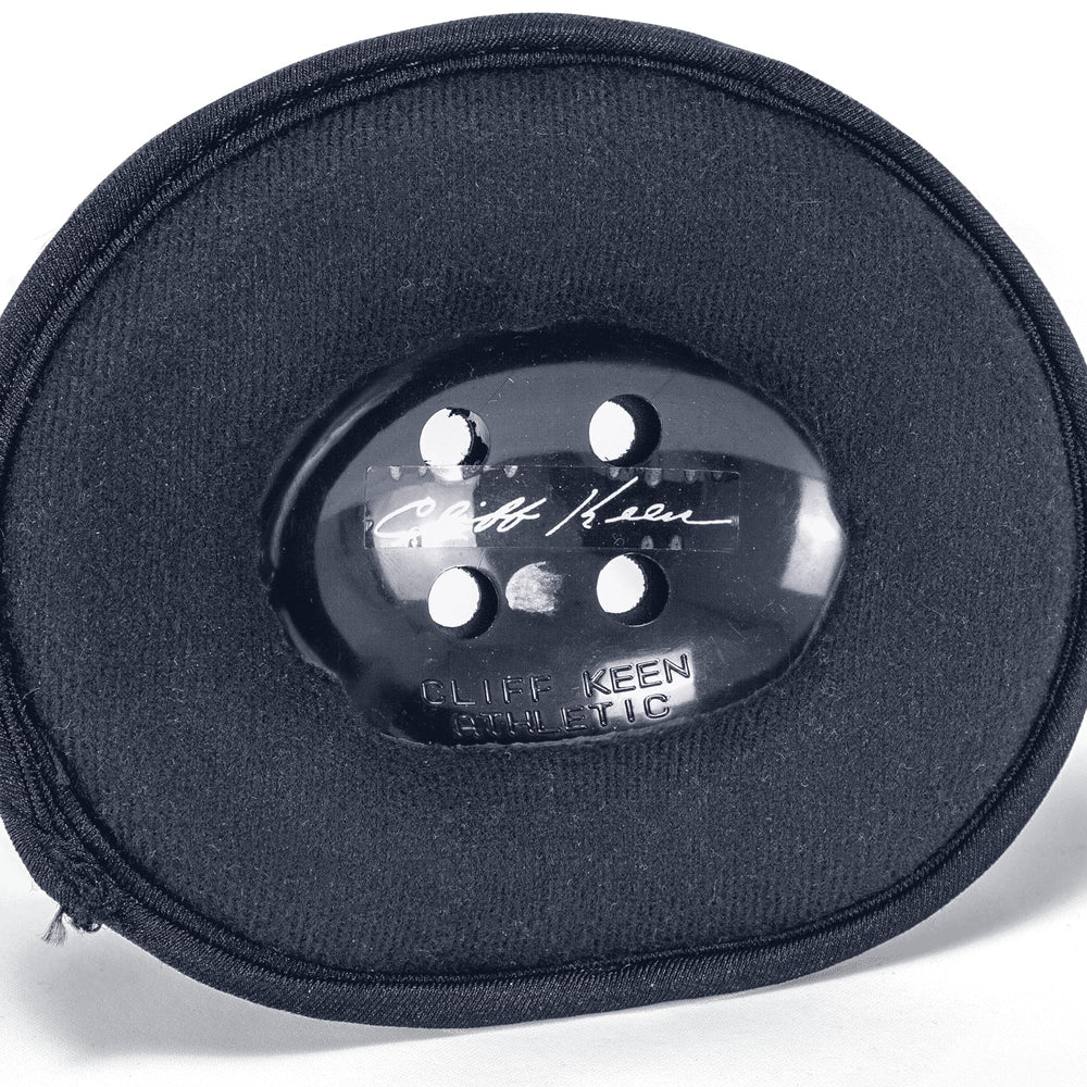 Cliff Keen headgear worn by young wrestler demonstrating stable fit and comfort advantage