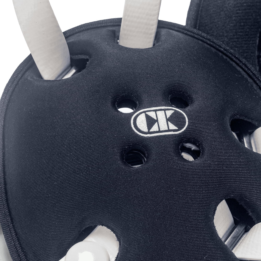 Cliff Keen headgear next to ruler showing scaled youth size and tournament-ready protection