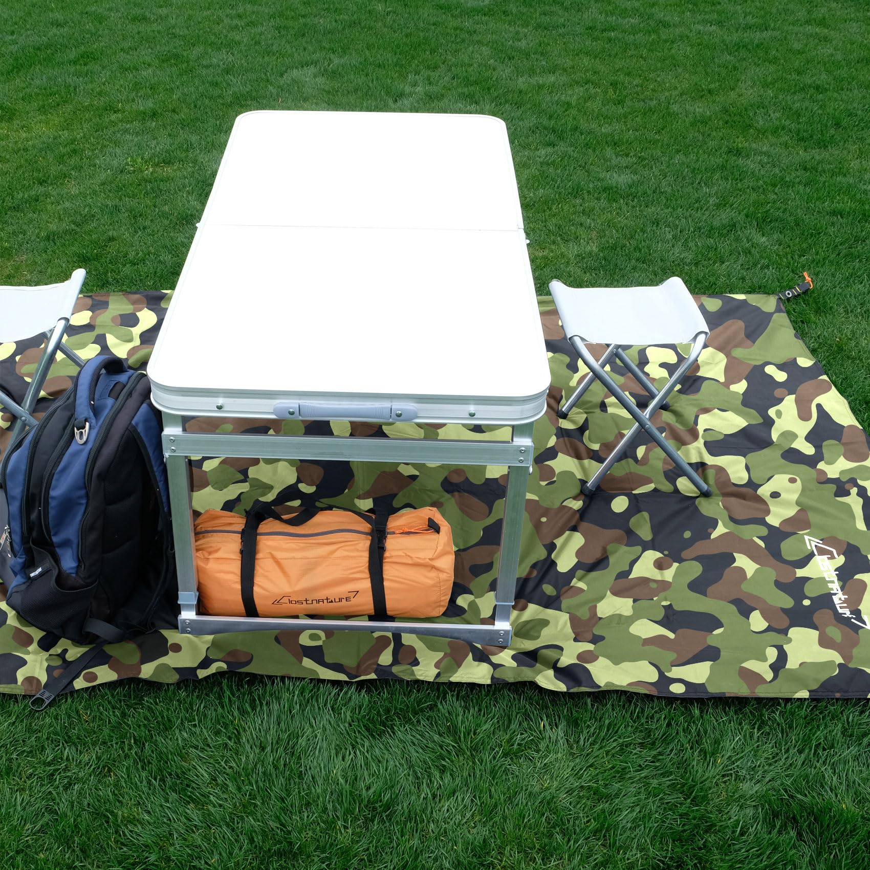 Clostnature tarp used as beach picnic groundcloth keeping gear clean and dry