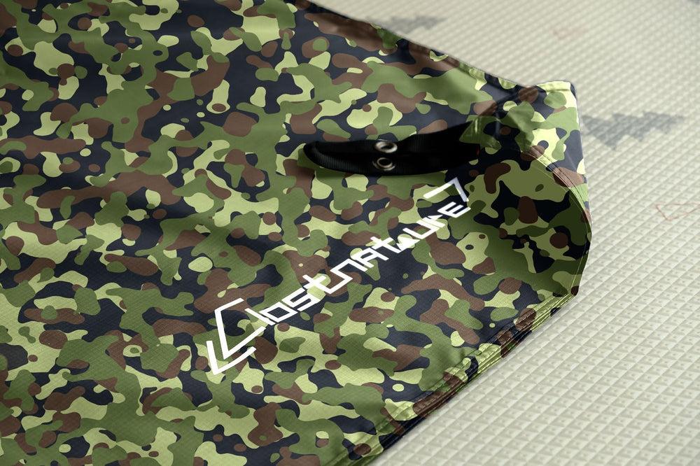 Clostnature tarp staked as a small shelter offering quick rain protection