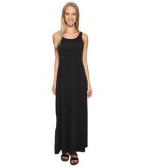 Columbia model wearing dress at beach demonstrating sun protection and style