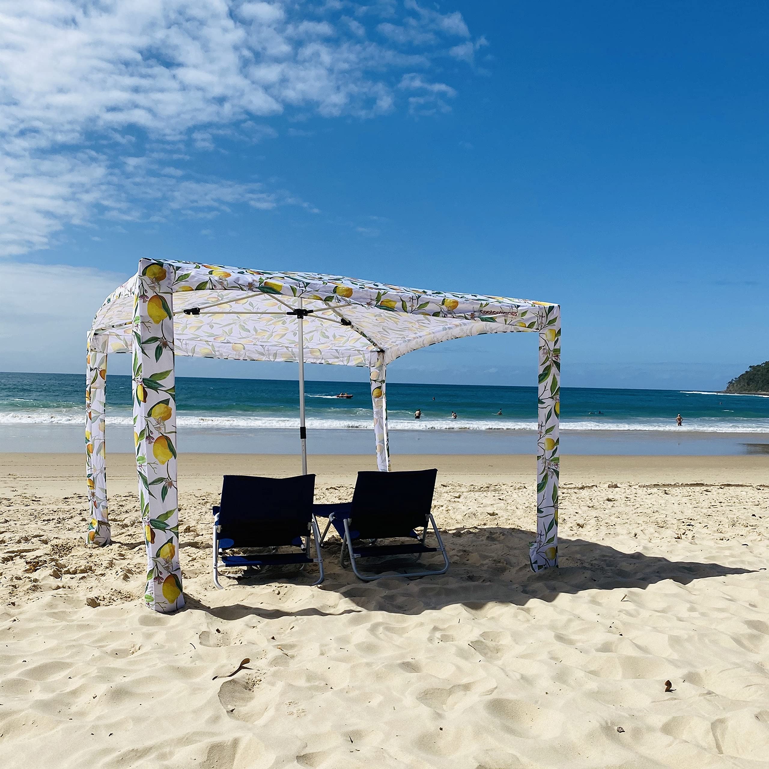 CoolCabanas next to beach towels for scale showing medium size capacity