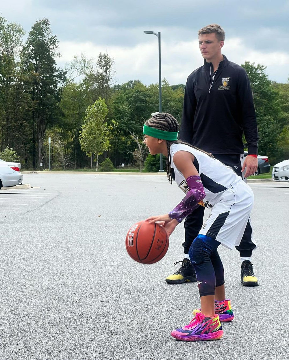 COOLOMG lifestyle in-game action portraying protection during basketball play
