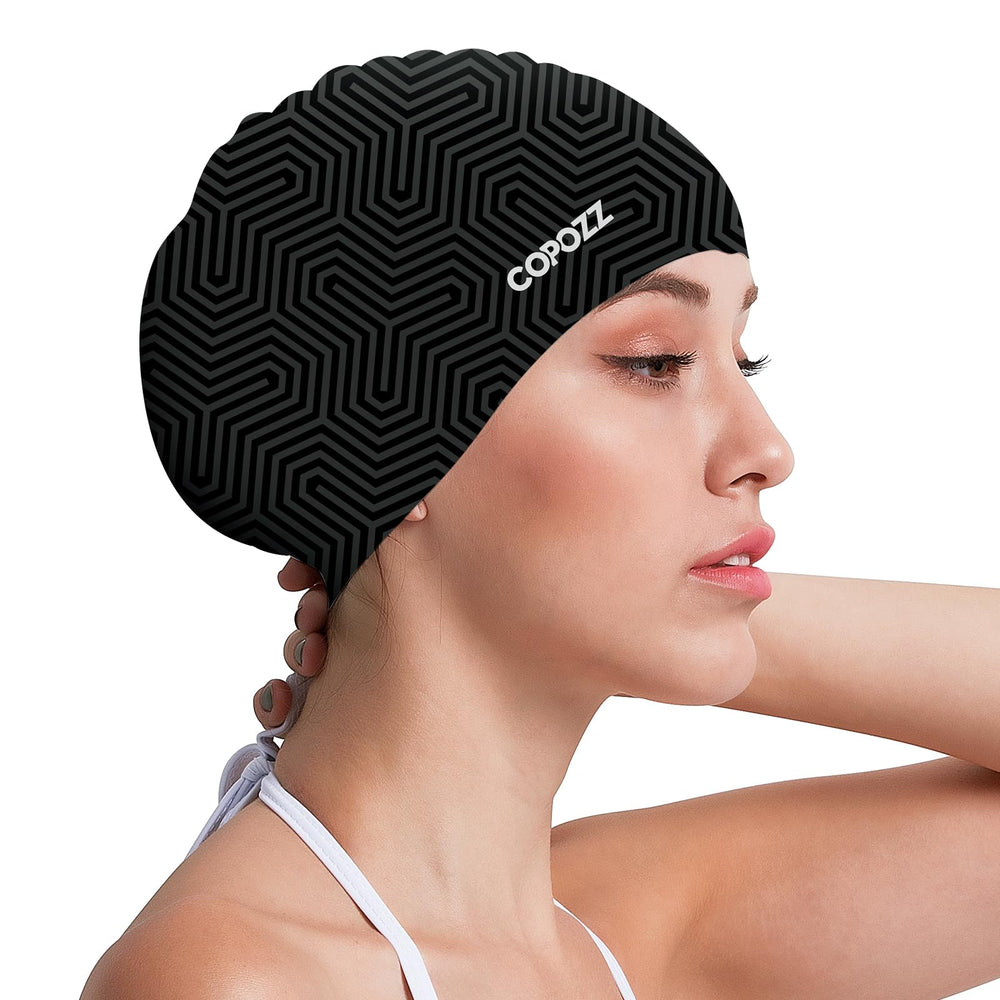 COPOZZ front view of black-stripes swim cap showing full pattern and secure fit