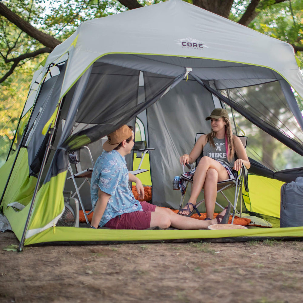 CORE tent next to family showing scale and spaciousness for group camping