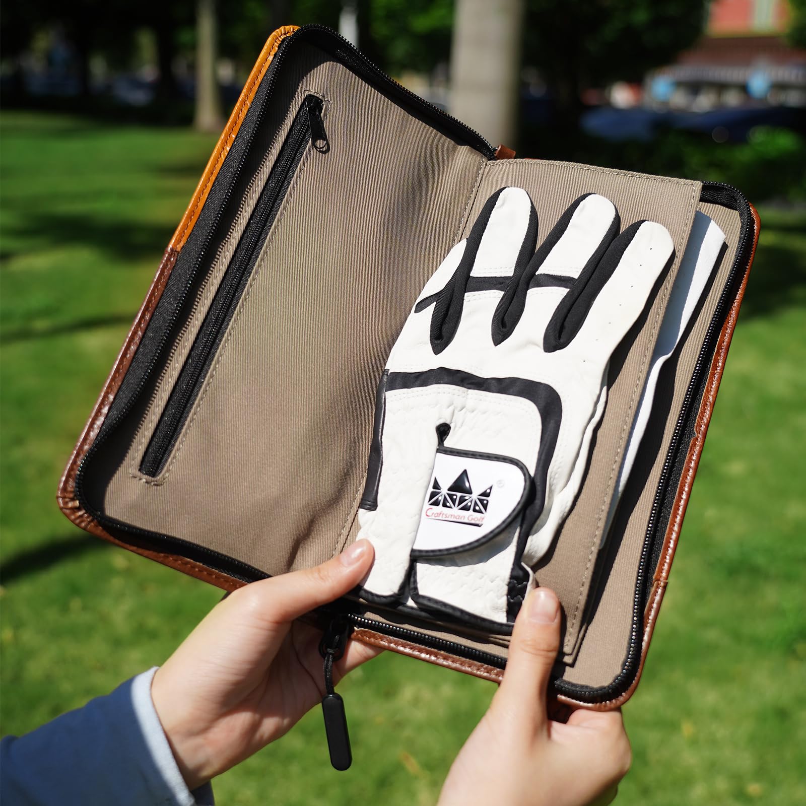 CRAFTSMAN GOLF pouch on golf cart next to clubs illustrating course-ready convenience