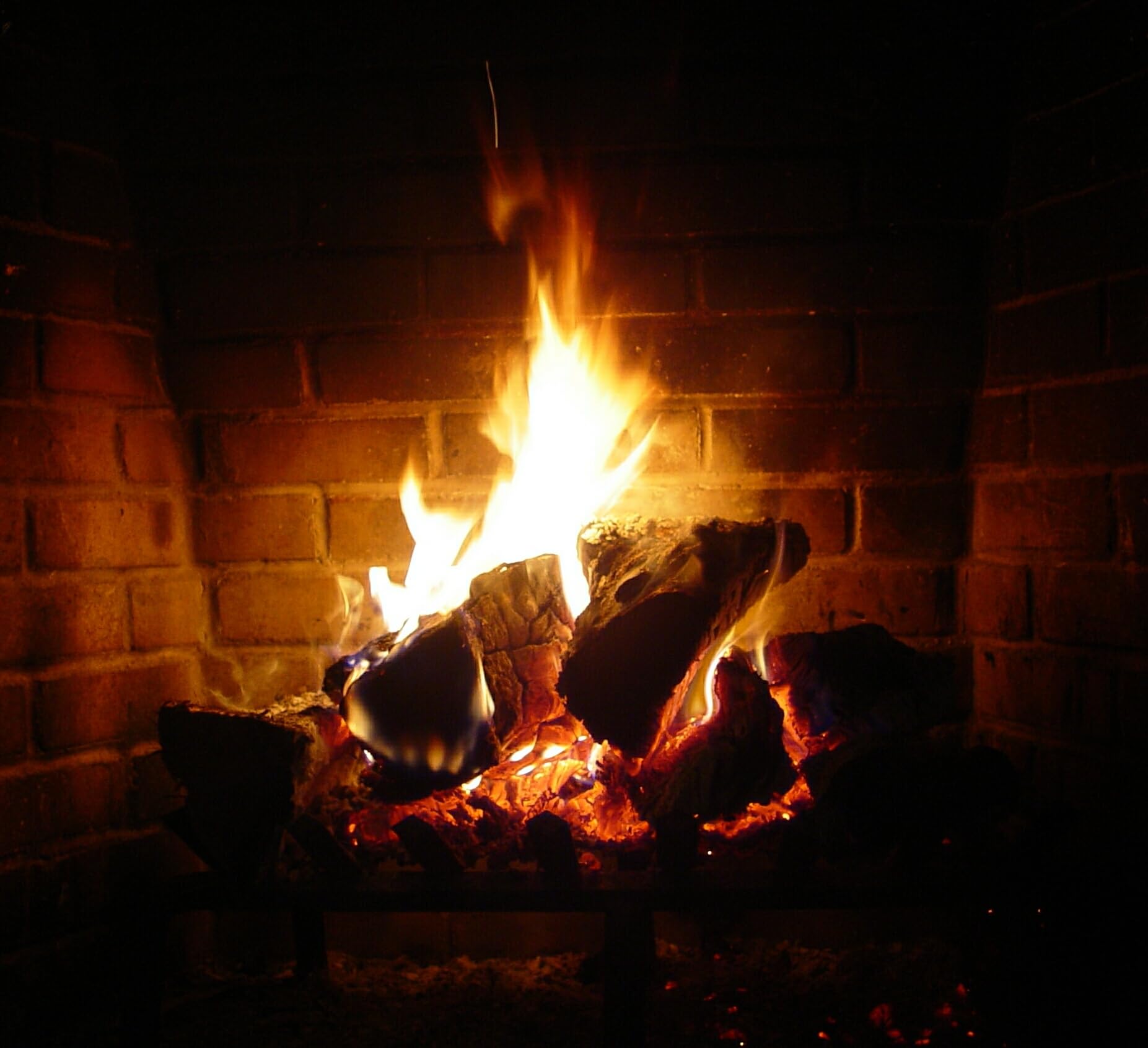 Creosote Ignite-O lighting charcoal in a grill for faster even heat-up