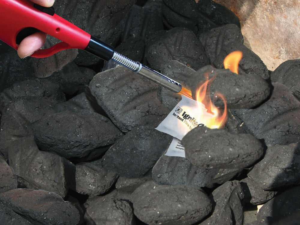 Creosote Ignite-O used to start a campfire offering dependable outdoor ignition