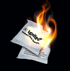 Creosote Ignite-O packet lit with flame demonstrating fast ignition benefit