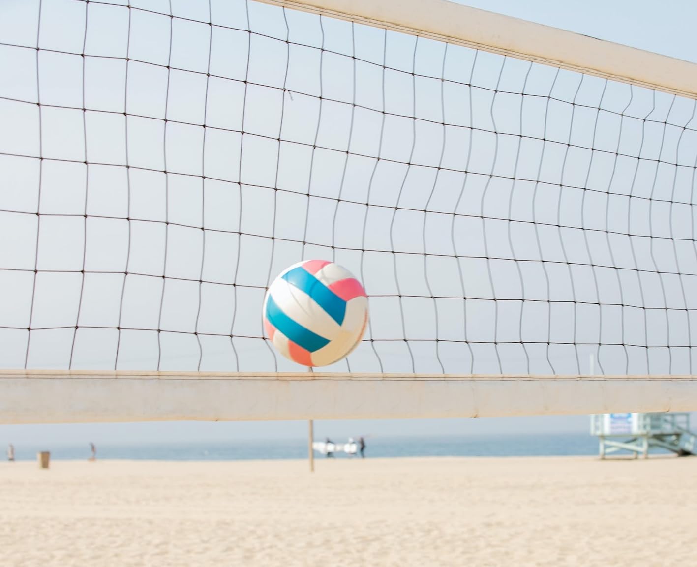 CVT volleyball net set up on a sandy beach illustrating weatherproof use and stable gameplay