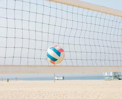 CVT volleyball net set up on a sandy beach illustrating weatherproof use and stable gameplay