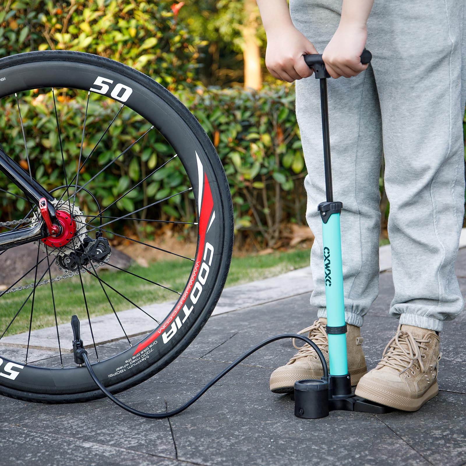 CXWXC pump in use inflating a road bike tire for fast on-ride prep