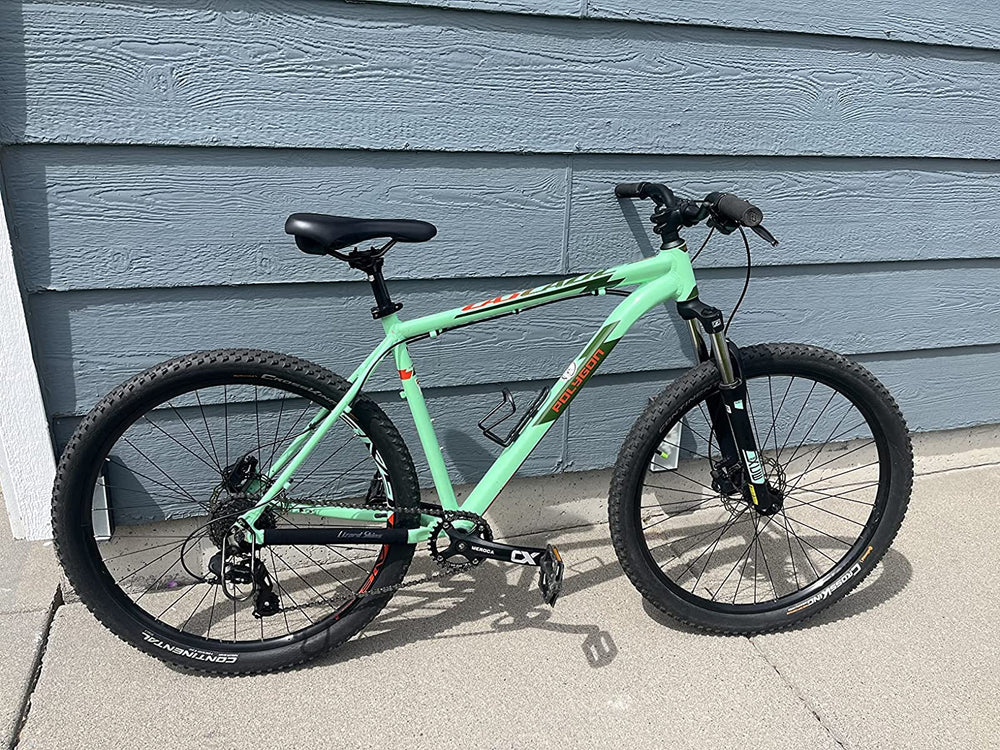 Cyclon crankset on commuter bike in urban setting, offers low-maintenance riding