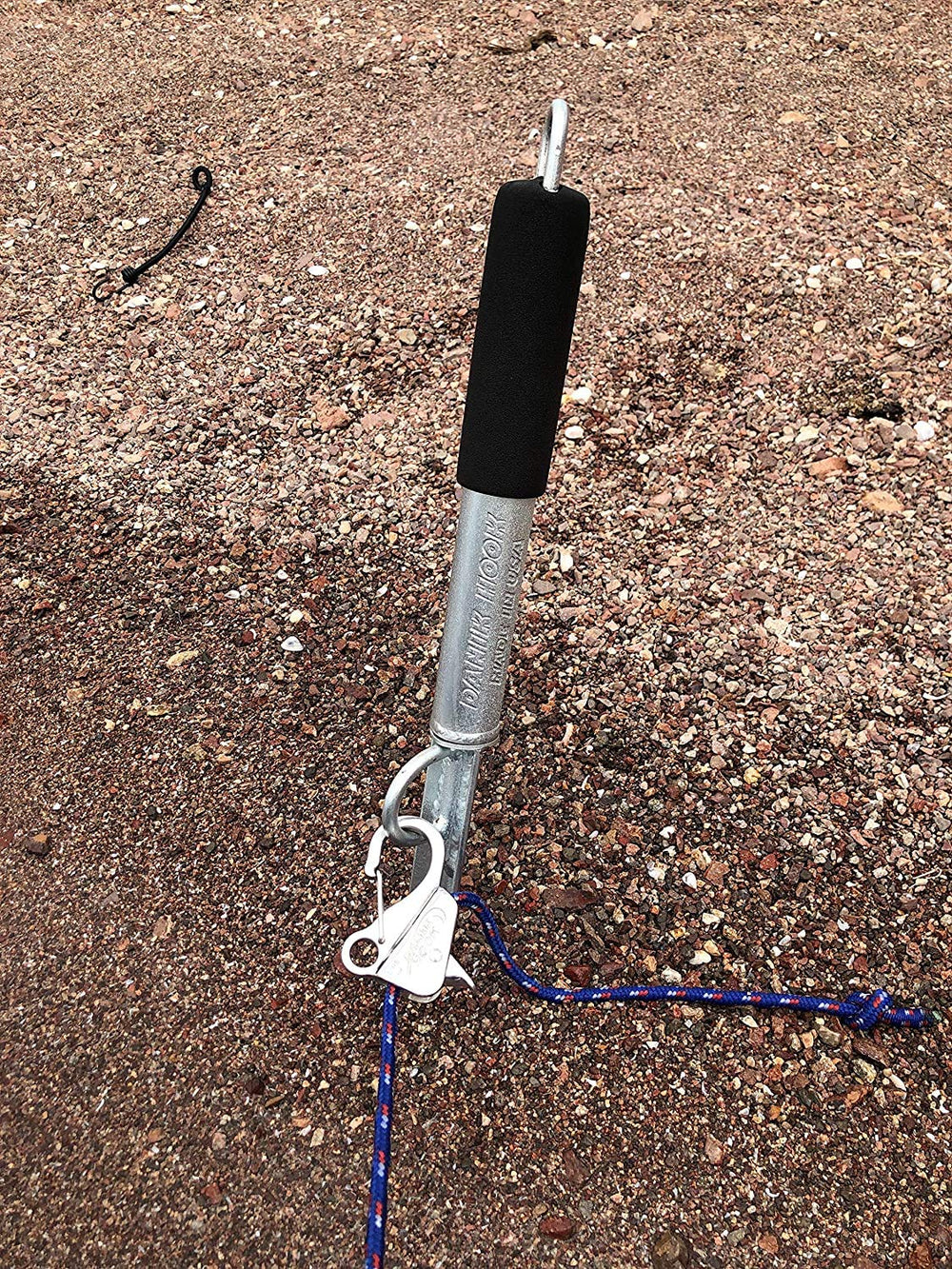 Danik Hook beside a hand for scale, Danik Hook compact size for easy handling