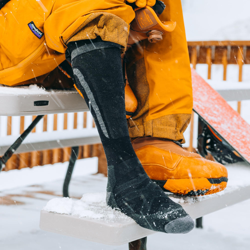Darn Tough Edge worn inside snowboard boot, secure fit and protection